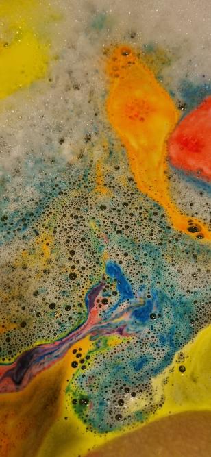 The swirling of colours from a bath bomb