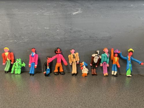 A line-up of colourful and fun clay figures - people, animals and monsters