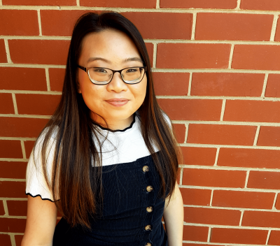 Cindy, a young Asian woman with long straight hair and glasses.