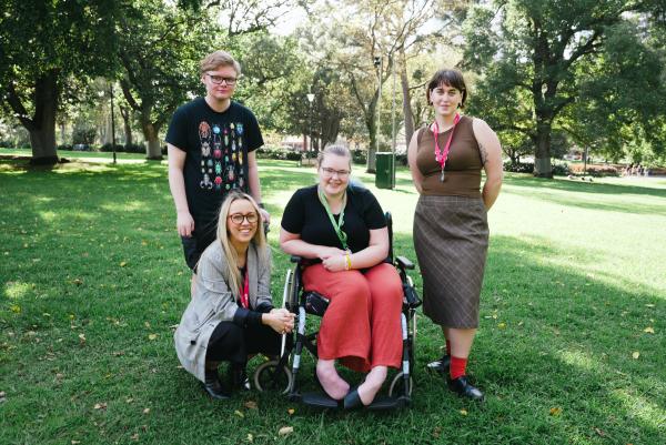 A picture featuring 2 disabled young people & 2 YDAS advocates in a park. 