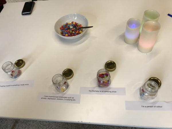 YTiR Mo Treat Yourself event: image of candy in jars with notes