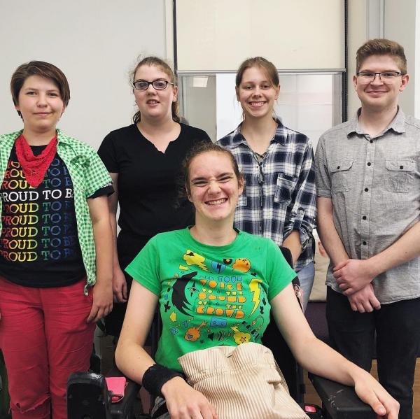 Five disabled co-designers smiling
