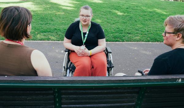 A YDAS advocate chatting with 2 disabled young clients, Jessi & Cameron.
